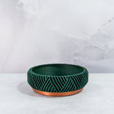 "Empty PEAK bowl planter front view, displaying copper base with striking forest pattern."